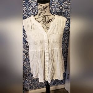 White sleeveless button down shirt. Size small.